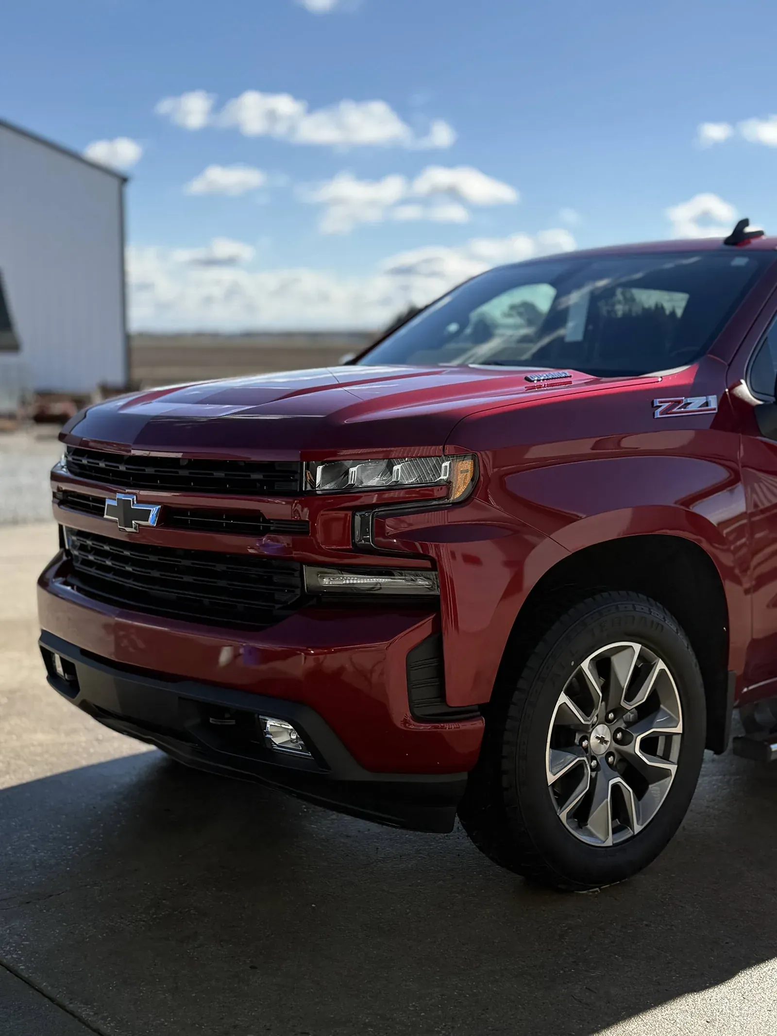 Red Chevy Silverado Z71 pickup with glossy paint after detailing